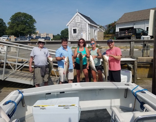A happy group of anglers after a successful day of fishing with Bluefin Charters!